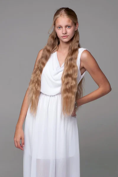 Young beautiful girl posing in white dress — Stock Photo, Image