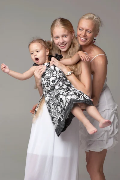 Beautiful mother and daughters — Stock Photo, Image