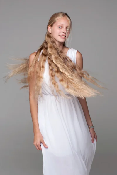 Young beautiful girl posing in white dress — Stock Photo, Image