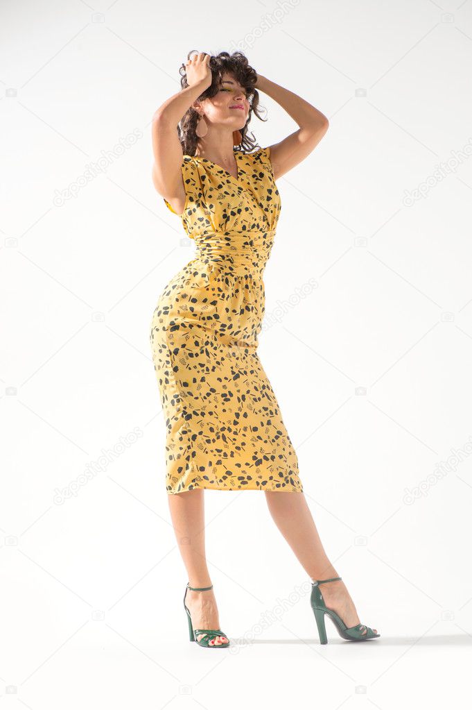 Beautiful girl in a yellow dress