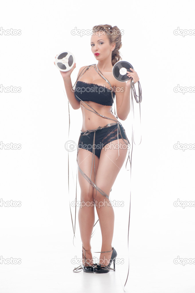 Attractive woman with an audio retro bobbins