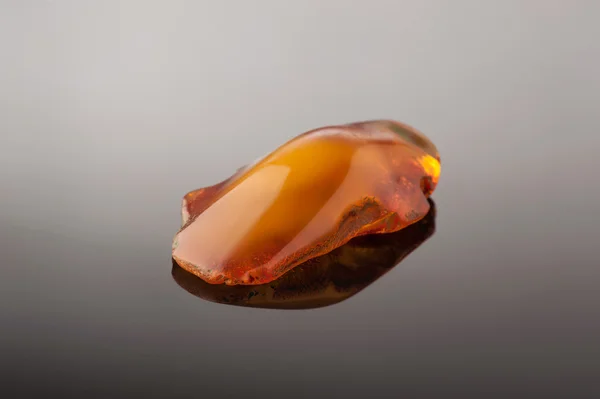 Amber on gray — Stock Photo, Image