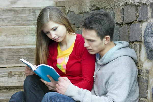 Students with book — Stock Photo, Image