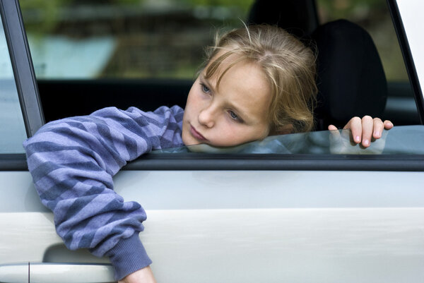 Sad girl in car