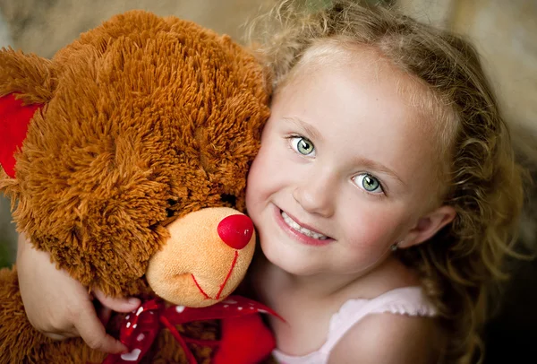 Girl with her teddy — Stock Photo, Image