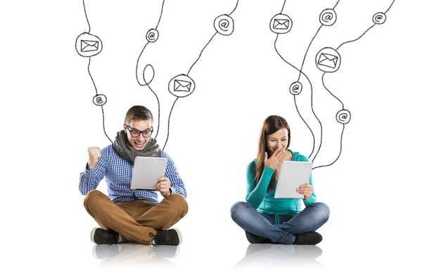 Young couple with tablets — Stock Photo, Image