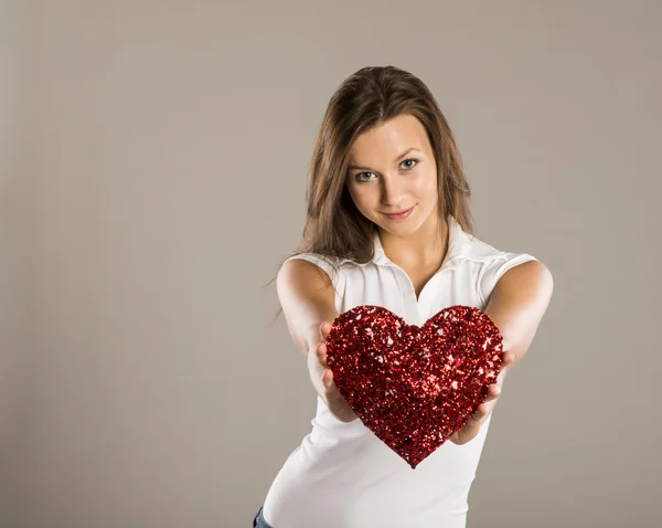 Woman with red heart — Stock Photo, Image