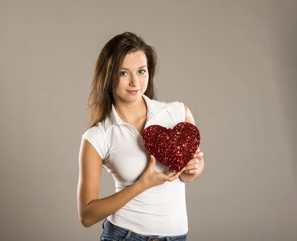 Woman with red heart — Stock Photo, Image