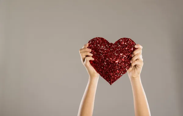 Woman with red heart — Stock Photo, Image