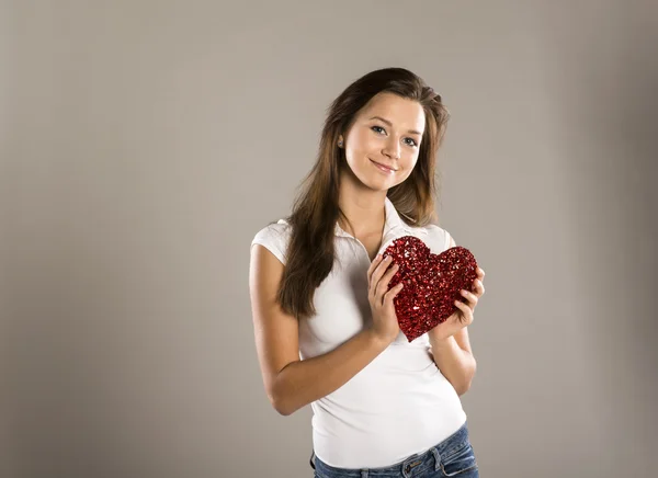 Woman with red heart — Stock Photo, Image