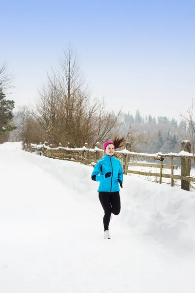 Woman running in winter — Stock Photo, Image