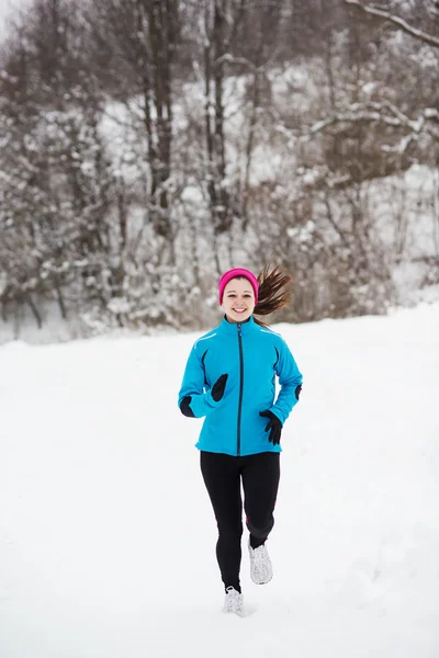 Mujer corriendo en invierno —  Fotos de Stock