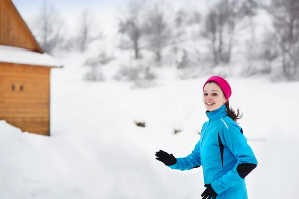 Woman running in winter Royalty Free Stock Photos