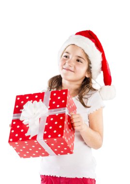Noel hediye ile Noel Baba şapkalı küçük kız