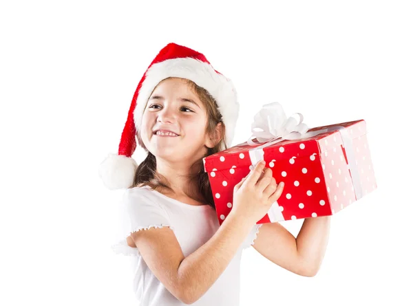与圣诞礼物圣诞老人的帽子的小女孩 — 图库照片