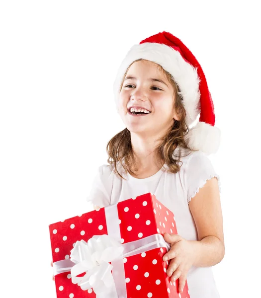 Small girl in santa hat with christmas gift — Stock Photo, Image