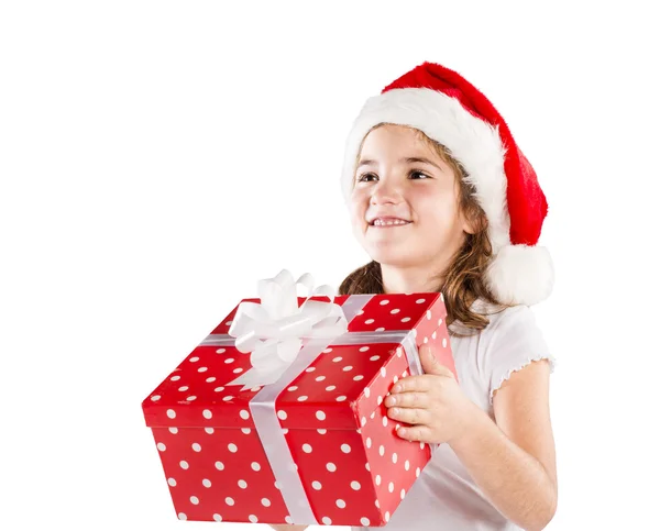 Small girl in santa hat with christmas gift — Stock Photo, Image