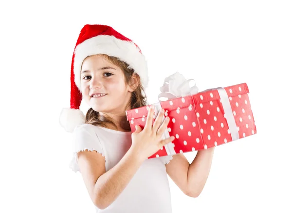 Noel hediye ile Noel Baba şapkalı küçük kız — Stok fotoğraf