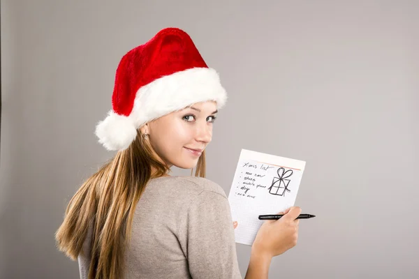 Beautiful woman with christmas hat — Stock Photo, Image