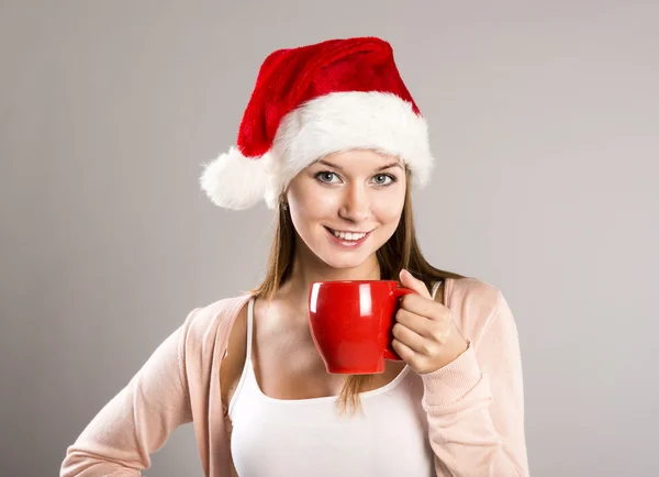 Hermosa mujer con sombrero de Navidad —  Fotos de Stock