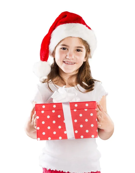 Petite fille en chapeau de Père Noël avec cadeau de Noël Photo De Stock