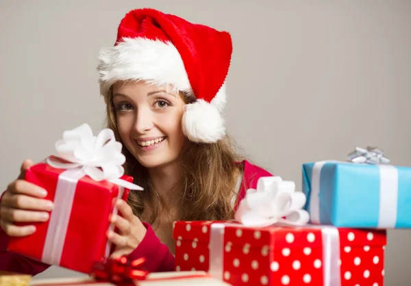 Cute girl with christmas presents — Stock Photo, Image