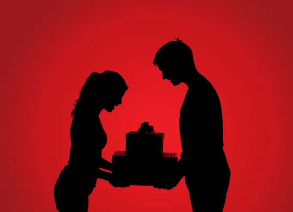 Silhouette di coppia con regalo — Foto Stock
