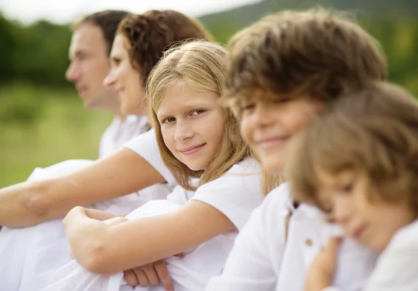 Big family is relaxing in green nature — Stock Photo, Image