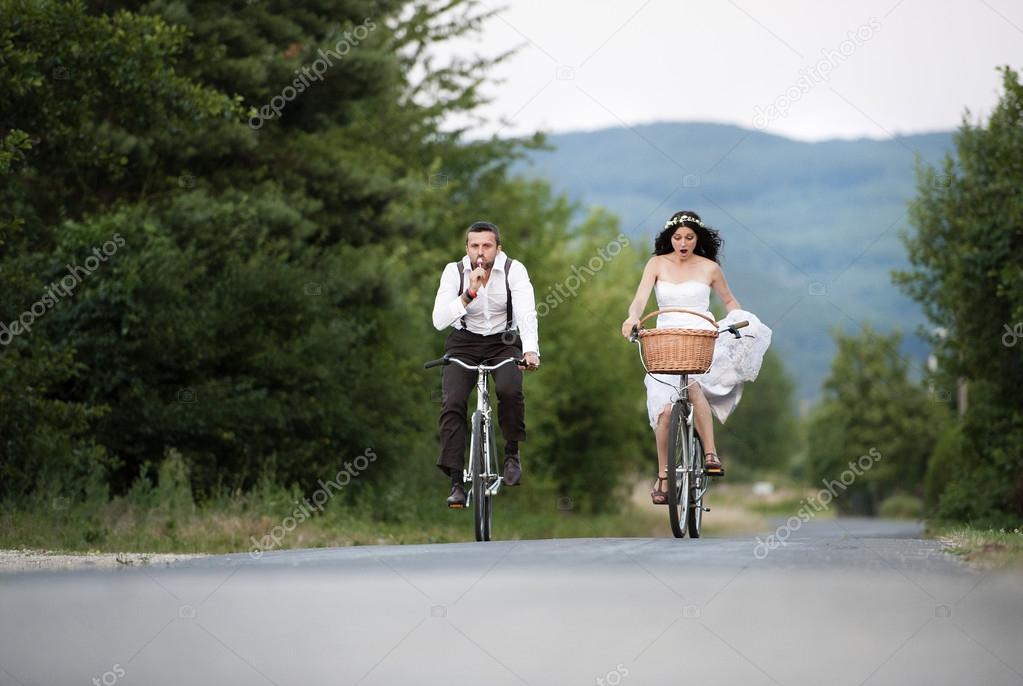 Bride and groom on the bikes