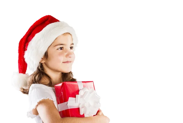 Niña en sombrero de santa con regalo de Navidad —  Fotos de Stock