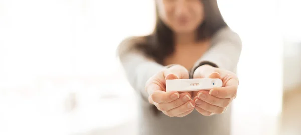 Woman with pregnancy test — Stock Photo, Image