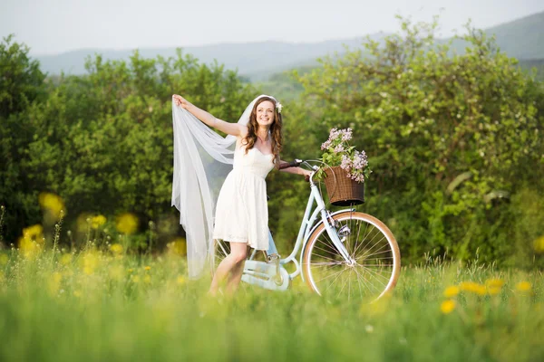 Bride with bike — Stock Photo, Image