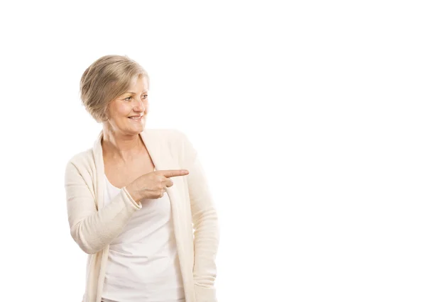 Senior woman pointing — Stock Photo, Image