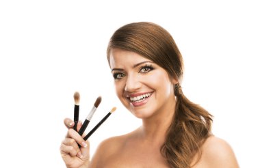 Woman holding brushes