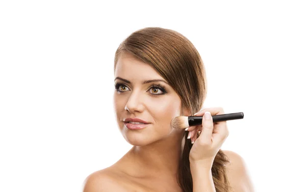 Woman putting makeup on herself — Stock Photo, Image