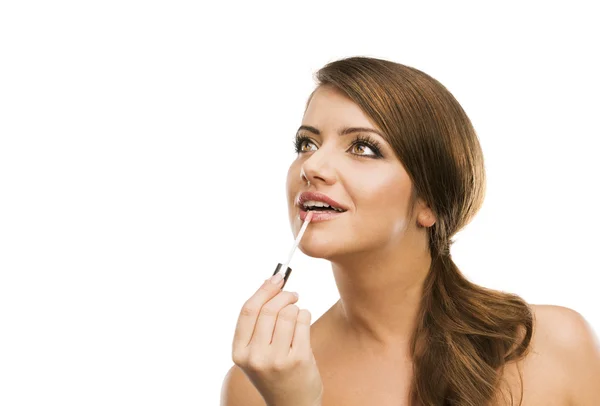 Woman putting makeup on herself — Stock Photo, Image