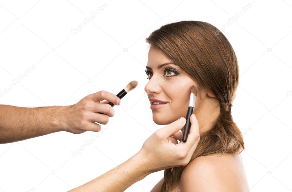 Woman with makeup brushes