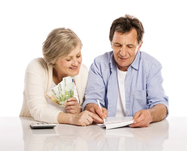 Senior couple with money — Stock Photo, Image