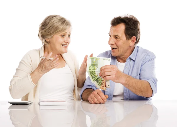Senior couple with money — Stock Photo, Image