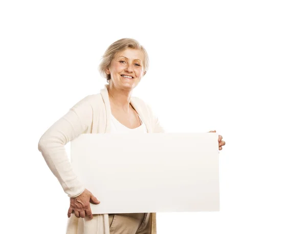 Senior woman with advertising board — Stock Photo, Image