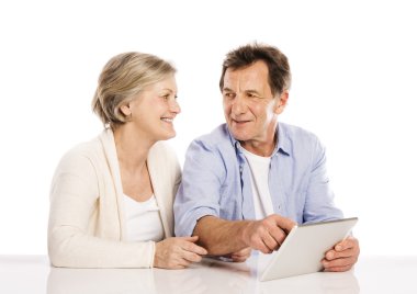 Senior couple with tablet clipart