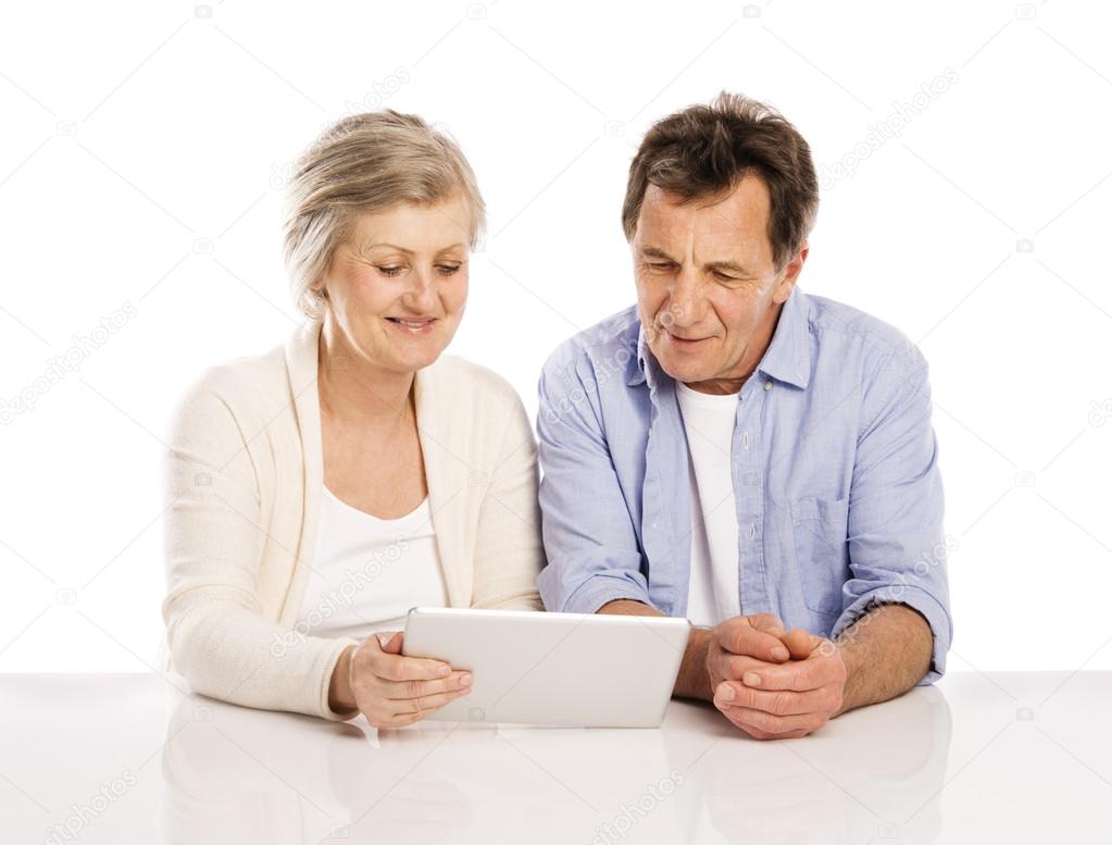 Senior couple with tablet