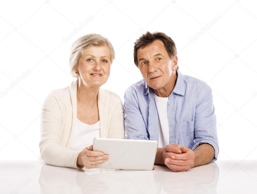 Senior couple with tablet