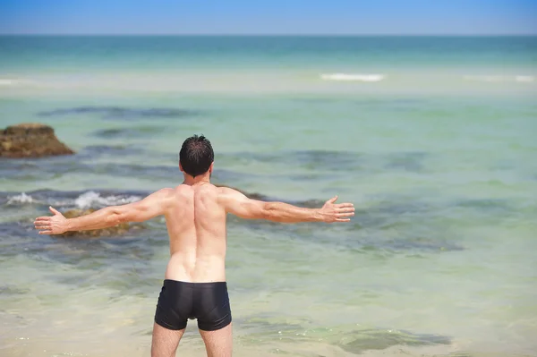 Man exercising on the beach Stock Image