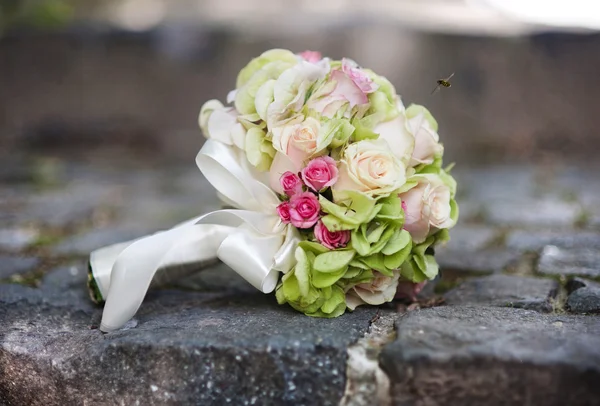 Wedding bouquet on stair — Stock Photo, Image