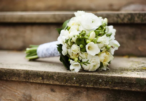 Wedding bouquet on stair — Stock Photo, Image