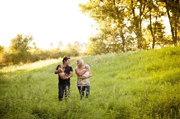 Couple walking with dogs — Stock Photo, Image