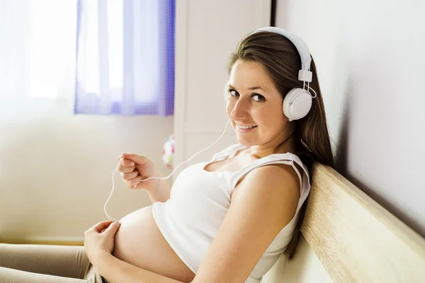 Woman listening to her baby — Stock Photo, Image