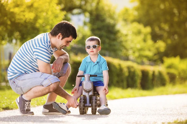 Father with son on motorbike — Stock Photo, Image
