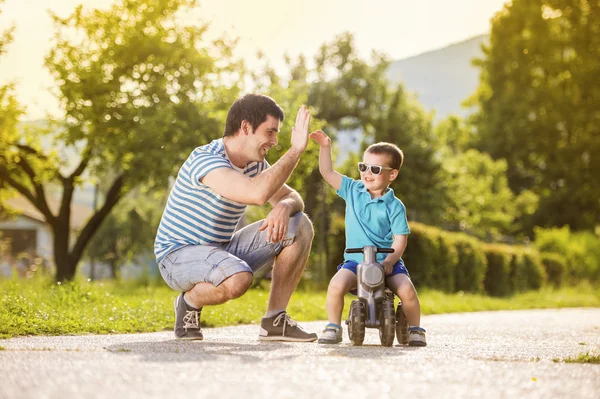 Father with son on motorbike — Stock Photo, Image